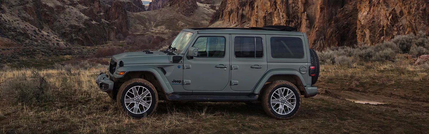 2025 Jeep Wrangler vs Ford Bronco Jeep standing on moutain area