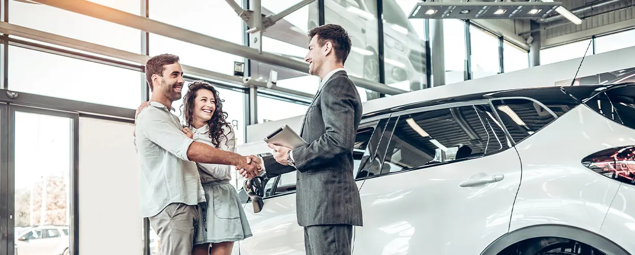 people car shopping in showroom
