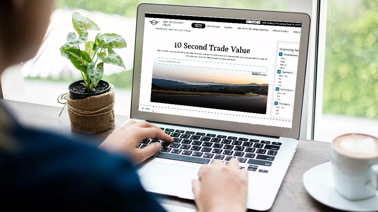 Person looking at the dealerships website on their laptop