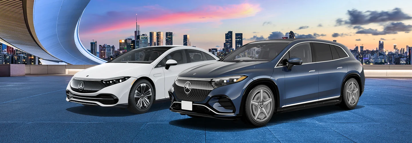 One white and one blue Mercedes-Benz vehicles with a city background