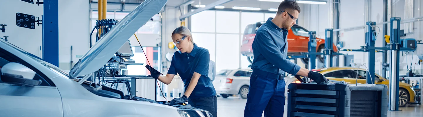 techs repairing cars in service deaprtment