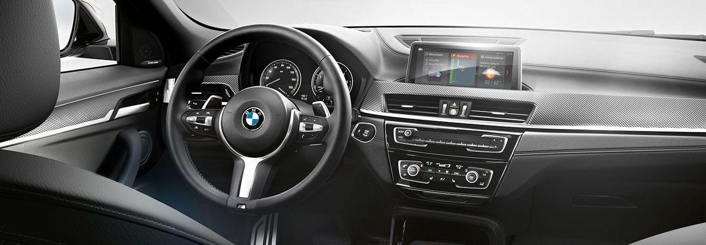 Interior view of a BMW X2’s dashboard and touchscreen display