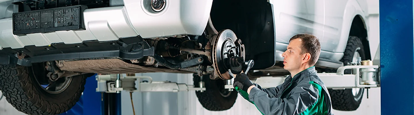 Service tech working on brakes