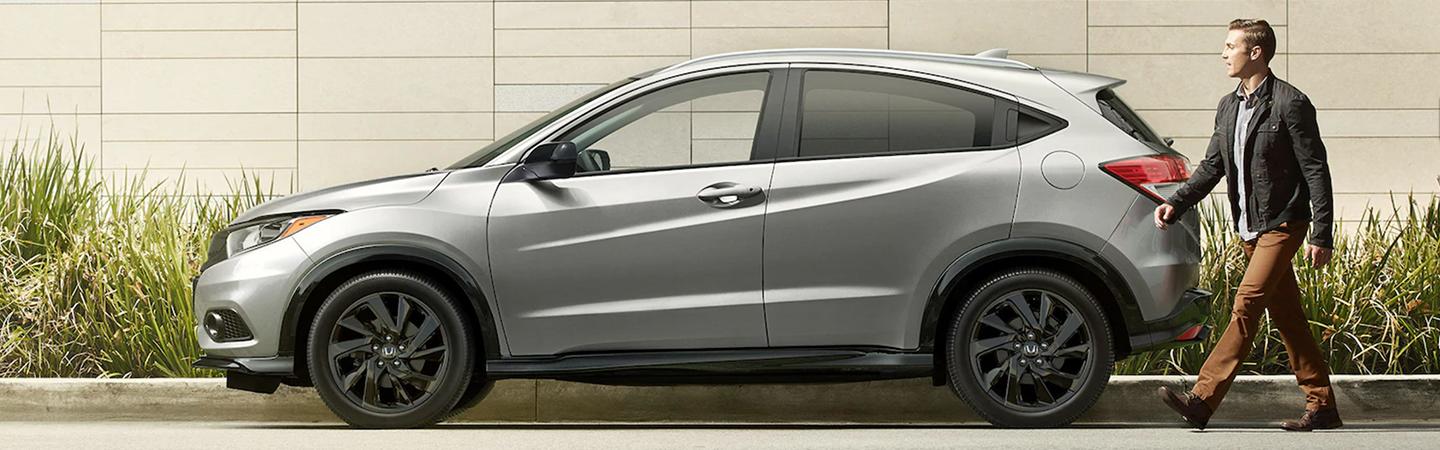 Side profile of a parked silver Honda HR-V