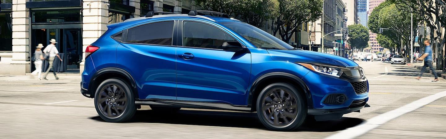 Side profile of a parked blue Honda HR-V