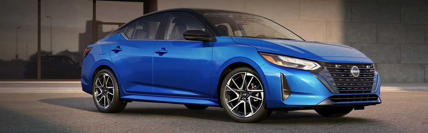 2024 Kia Forte vs Nissan Sentra front side in blue 