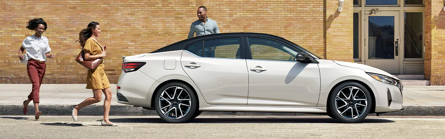 2024 Kia Forte vs Nissan Sentra side front in white
