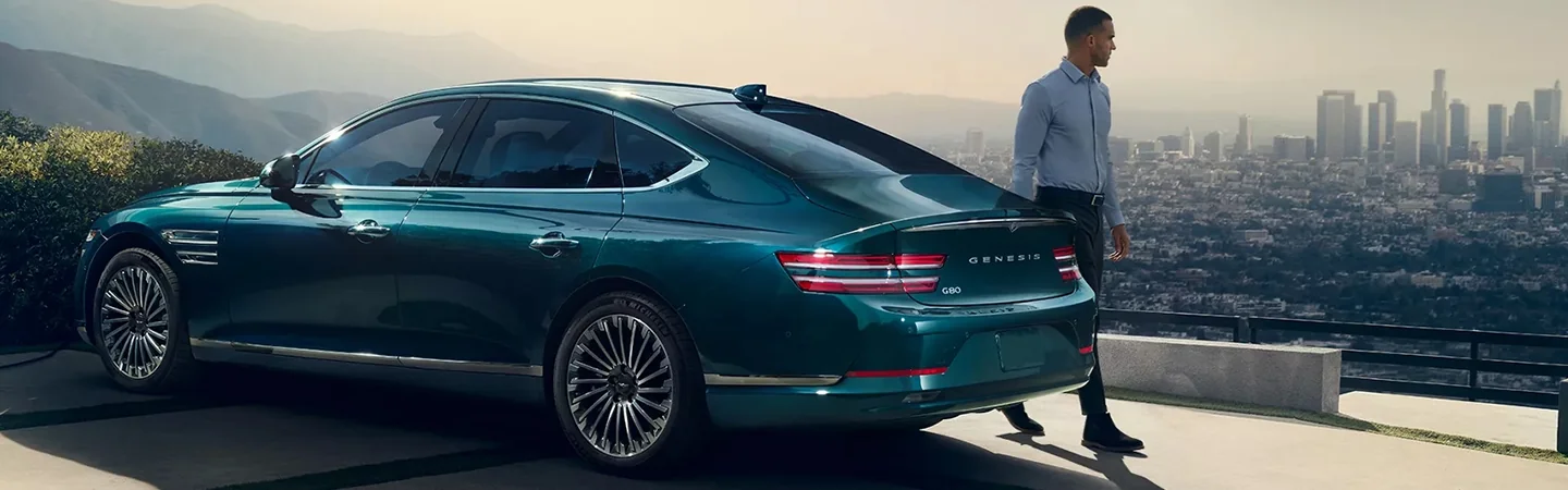 2024 Genesis Electrified G80 vs Tesla Model S lightgreen color side view 