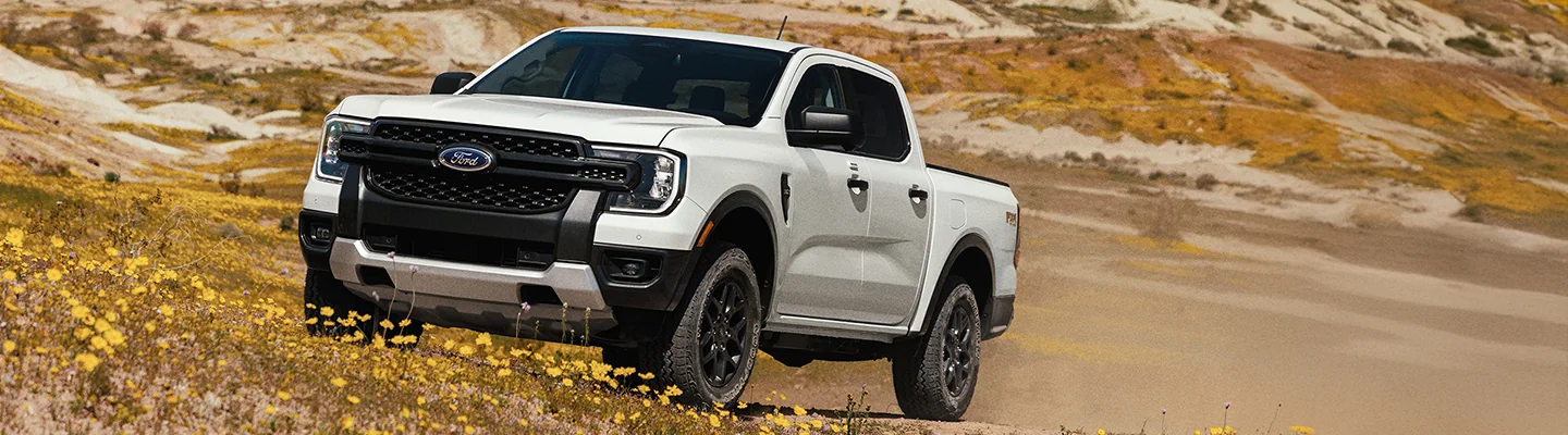 Ford truck driving up a hill