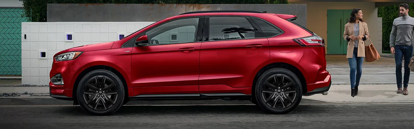 2024 Ford Edge vs 2024 Chevy Blazer side front in red