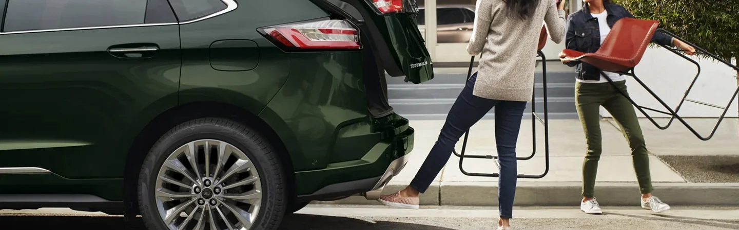 2024 Ford Edge vs 2024 Chevy Blazer side back in green