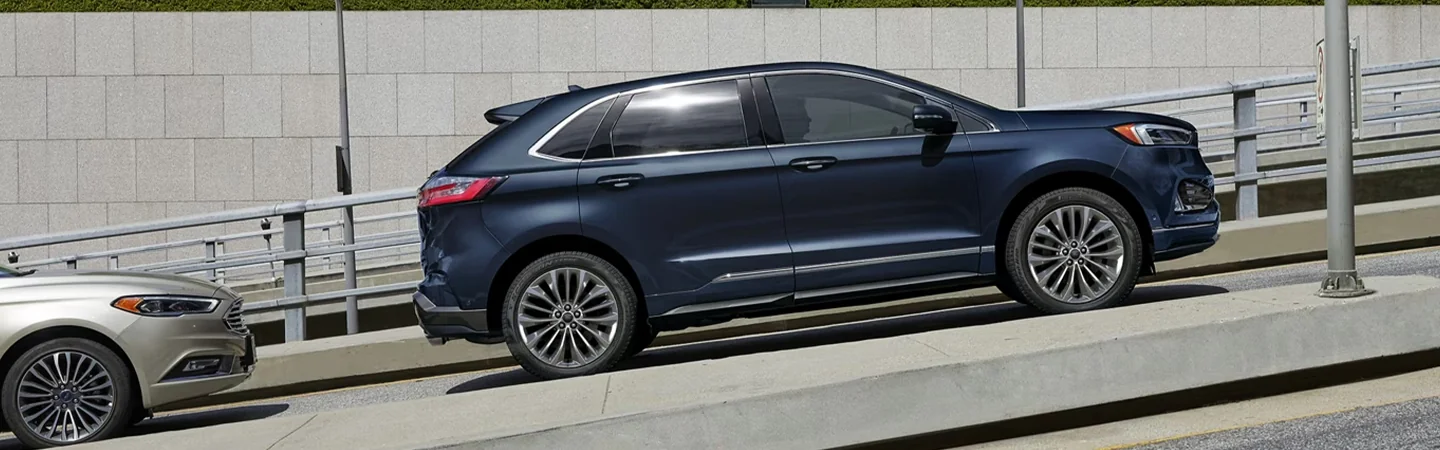 2024 Ford Edge vs 2024 Chevy Blazer side front in blue