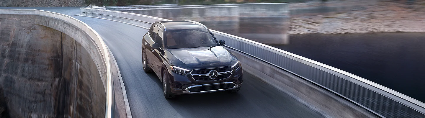Mercedes-Benz GLC 300 driving over a water dam