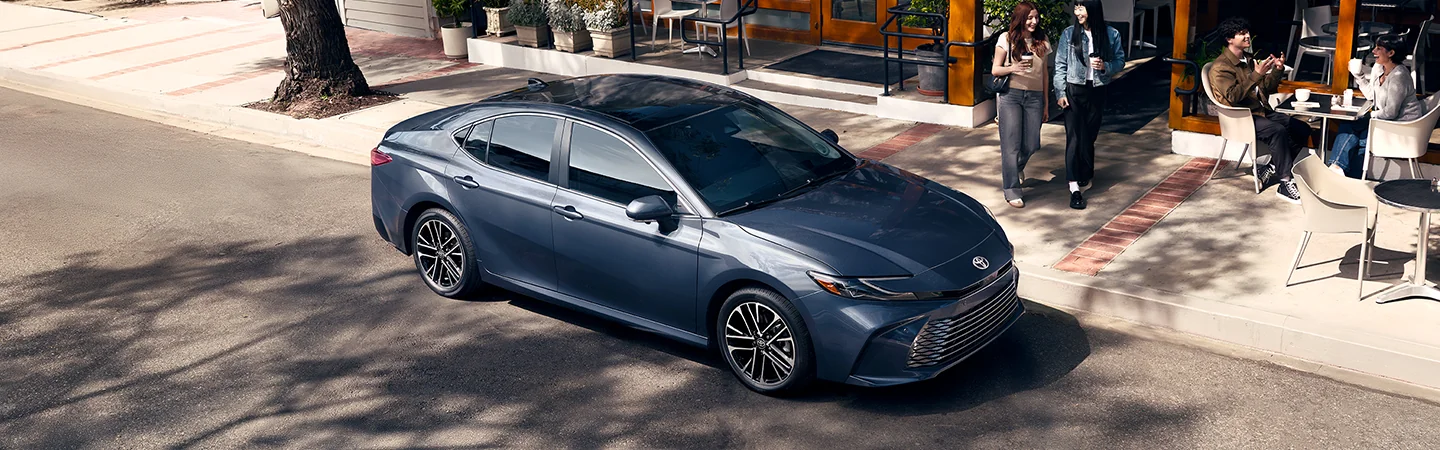 top side view of a blue 2026 Toyota Camry parked on a city street