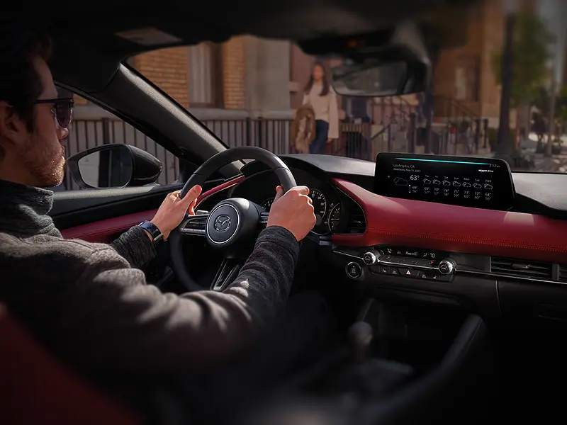 classic appointments inside the dashboard control area of the Mazda3 Hatchback
