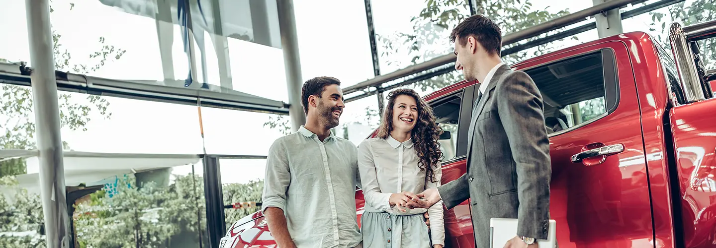 people shopping for a new car at our dealership showroom
