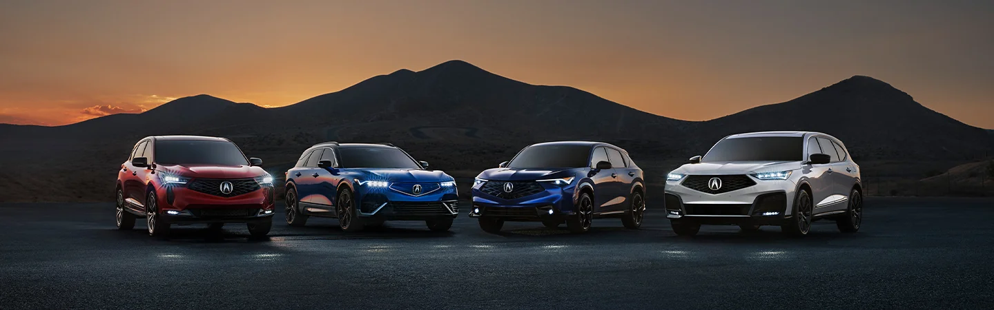 Acura model line up with a mountiain in the back ground