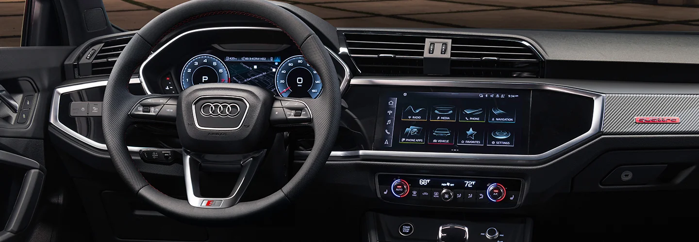 Interior view of the drive side dashboad and tech in a 2025 Audi Q3