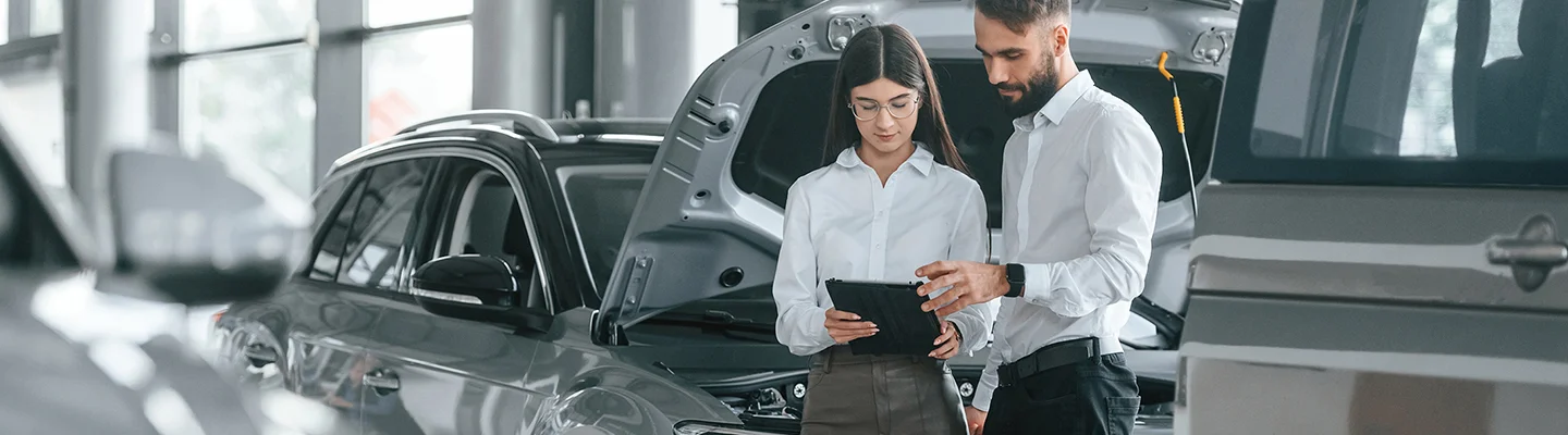 discussing new car terms in showroom