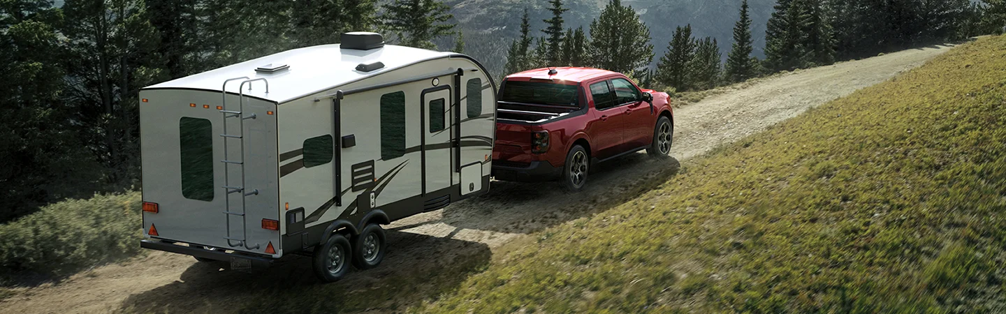 red Ford Maverick towing