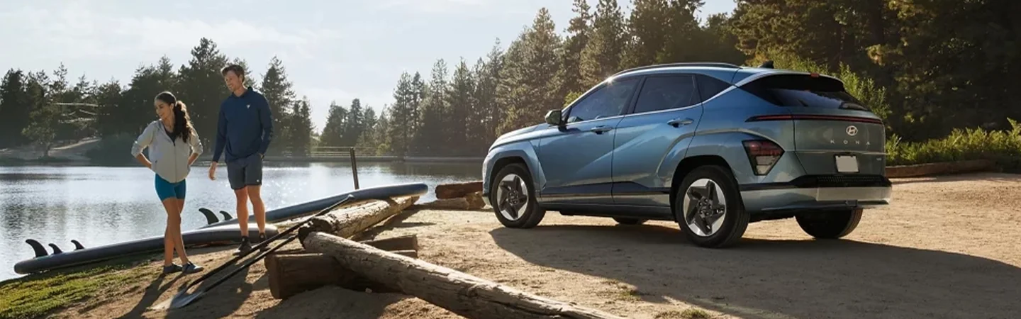 Hyundai Kona Electric side view on dirt road