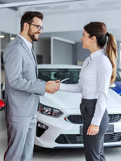 Finance manager talking to customer about options for leasing and buying at Lamborghini Charlotte in Charlotte, NC