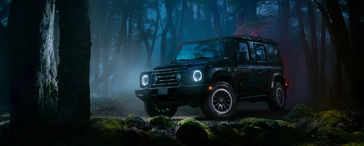 INEOS Grenadier Fieldmaster parked in the woods