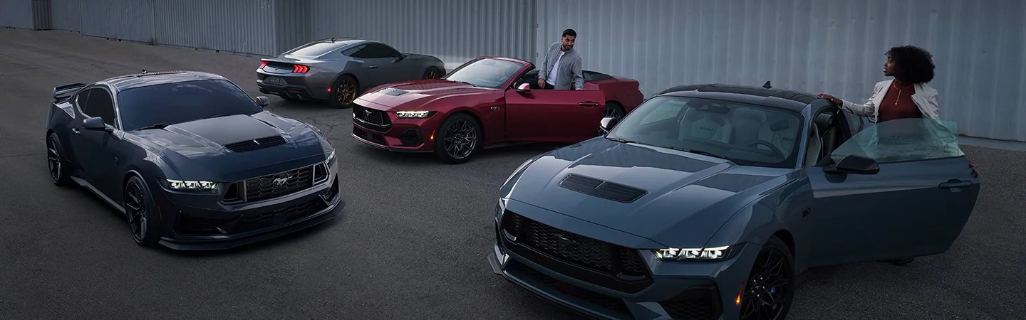 2024 Ford Mustang vs Dodge Charger front side in silver