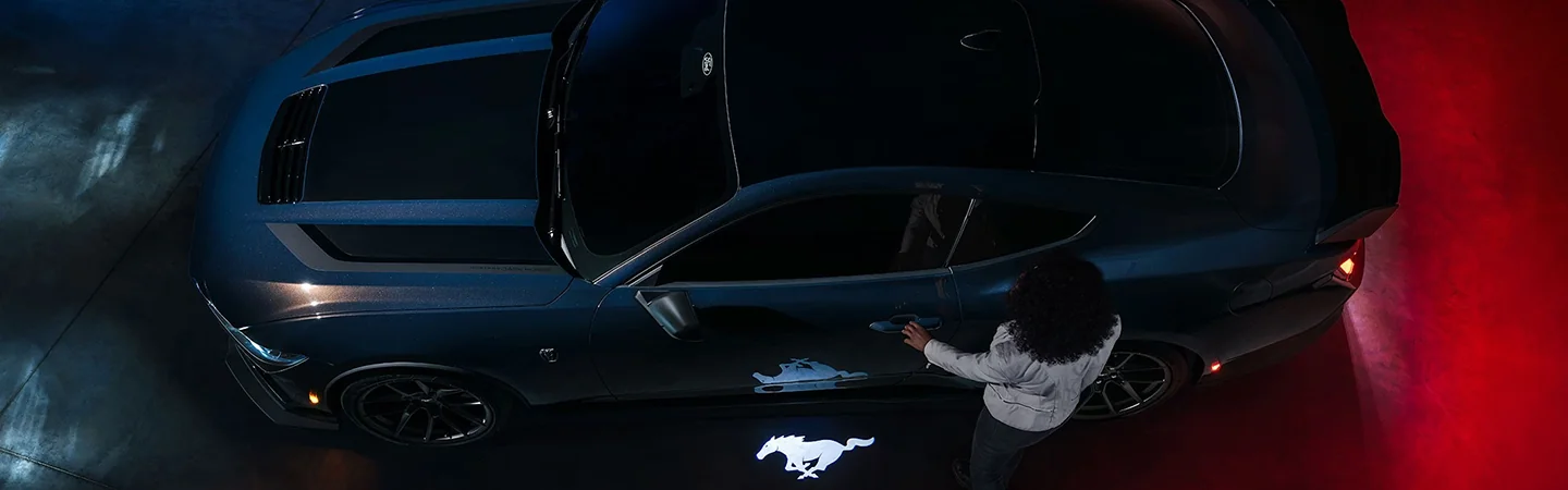 2024 Ford Mustang vs Dodge Charger side view in blue