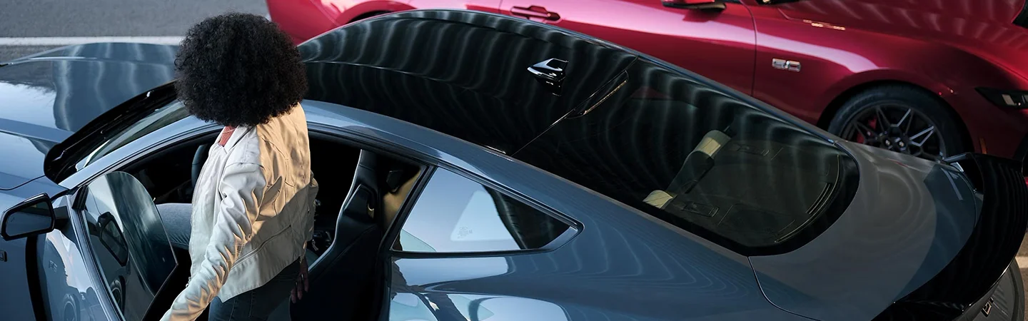 2024 Ford Mustang vs Dodge Charger top view in blue