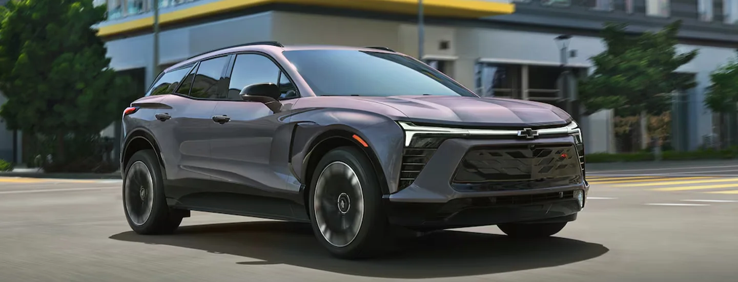 Gray 2025 Chevrolet Blazer EV driving in the city