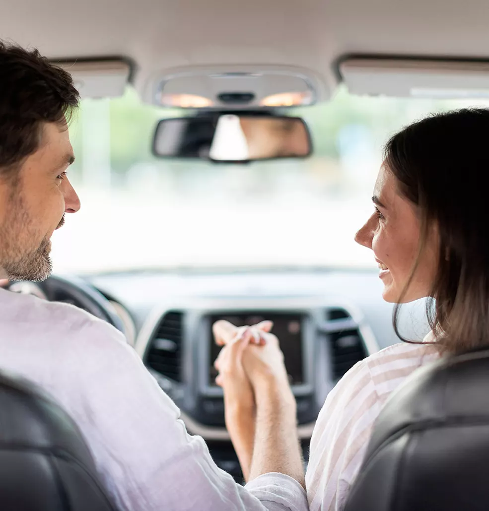 Couple holding hands in their new 2026 Honda Civic