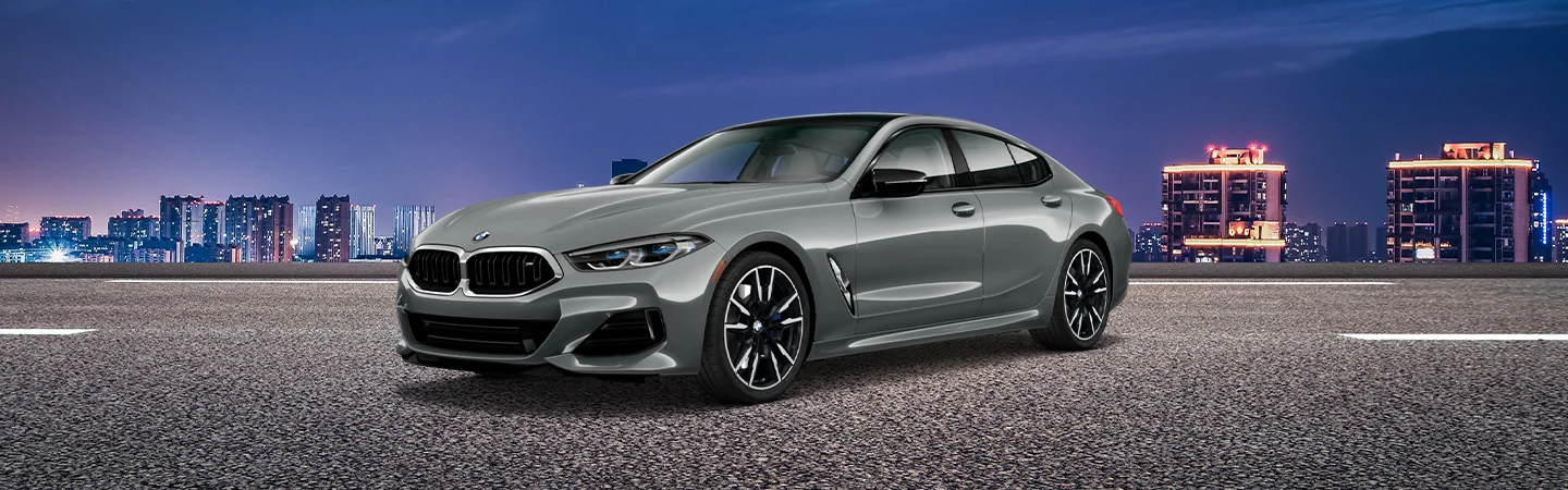 2025 BMW 8 Series grey color car parked on the road