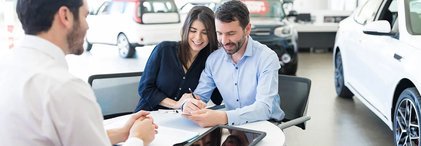people shopping for a new car at our dealership showroom