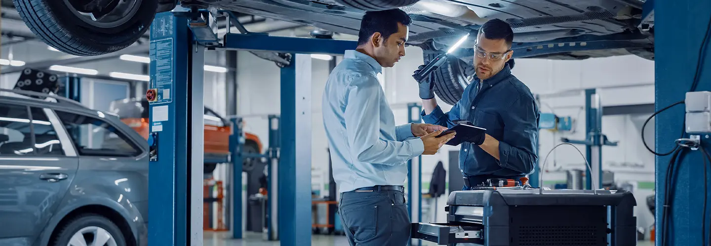 techs working on car