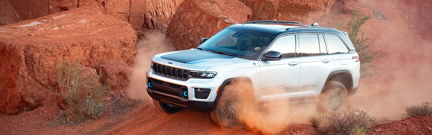 2025 Jeep Grand Cherokee white color car driving off road