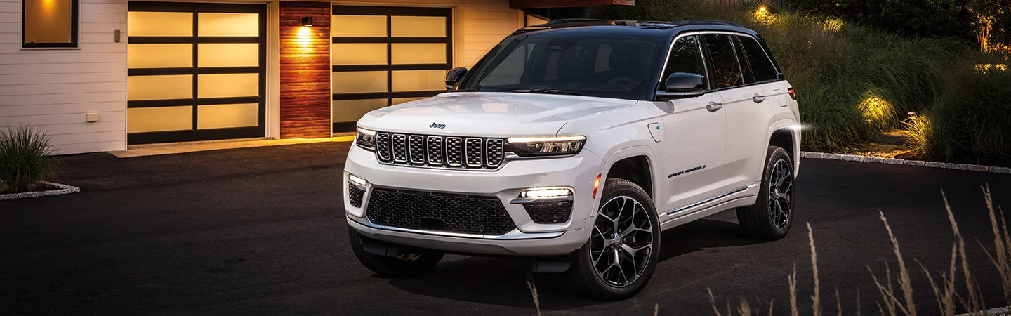 2025 Jeep Grand Cherokee white color car parked outside the house