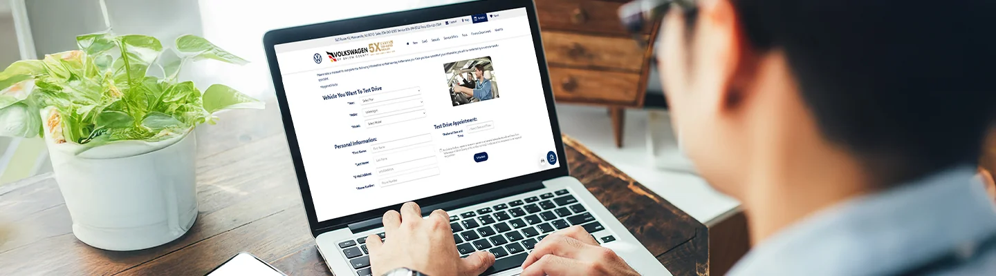 Customer looking on line to Schedule a Test-Drive at Volkswagen of Salem County