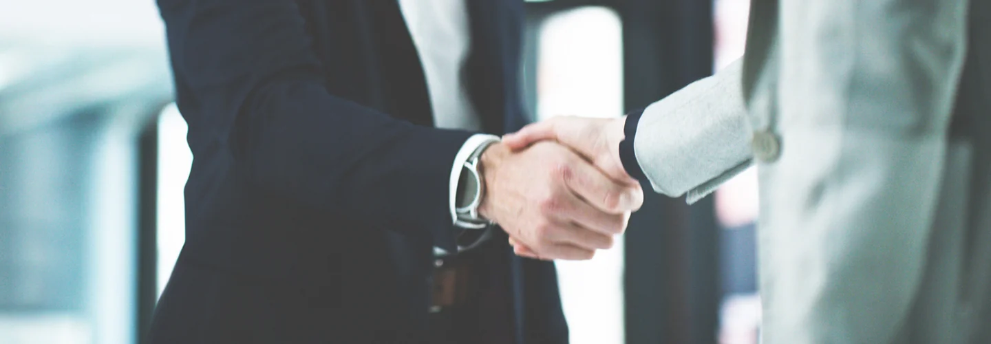 Two people shaking hands