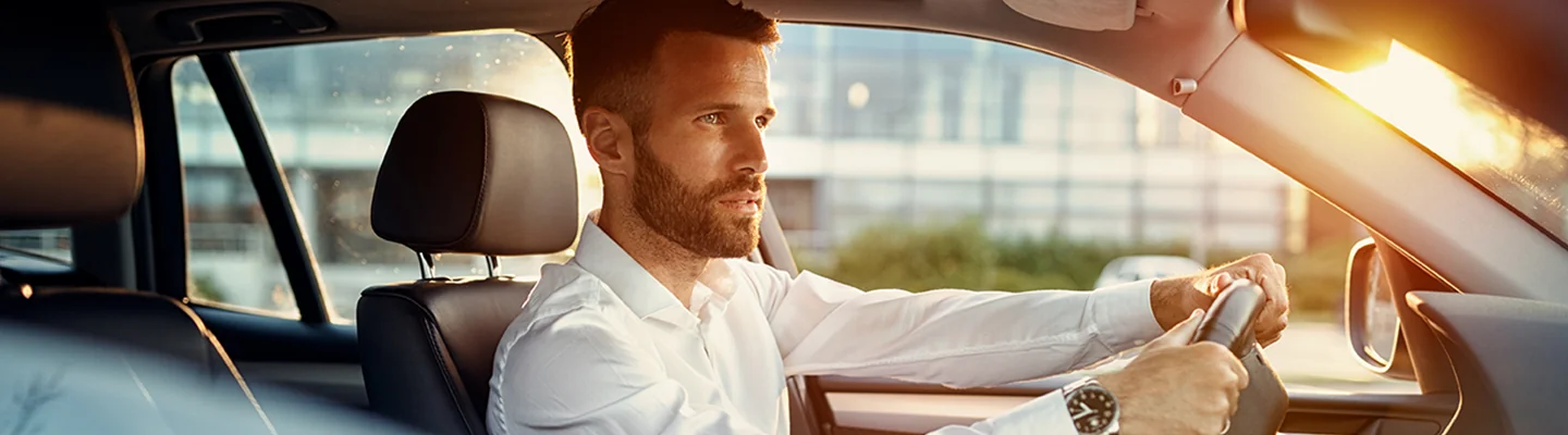 Man driving a Maserati