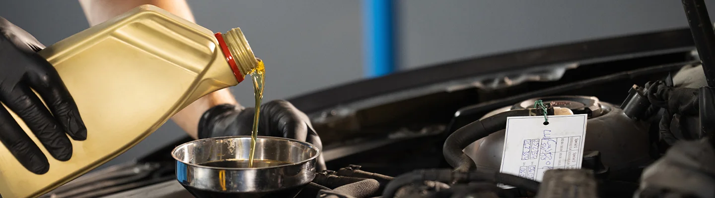 Oil change being done by a service tech at Bob Bell Ford