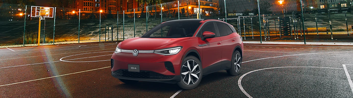 a red VW ID.4 parked on a basketball court