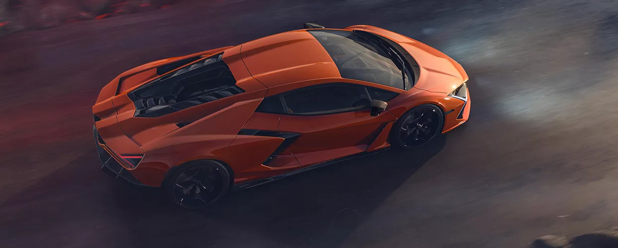 2026 Lamborghini Revuelto driving down a road