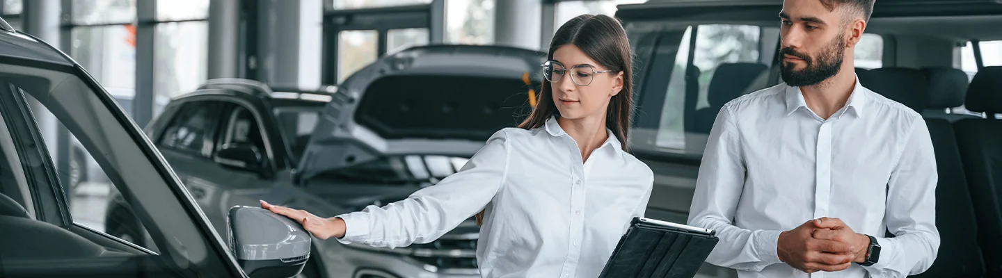 Car salesperson showing a customer the Trax at Dan Vaden Chevrolet Brunswick