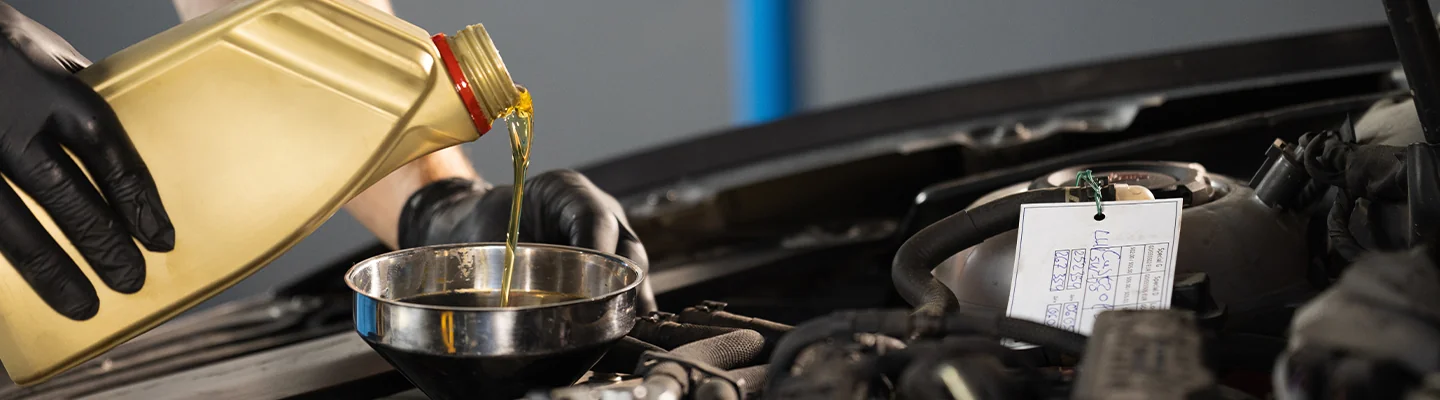 oil being poured into engine