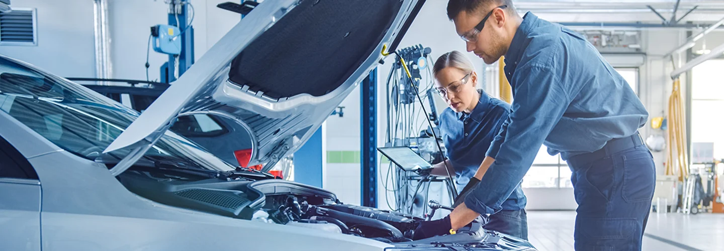 2 service techs working on an engine