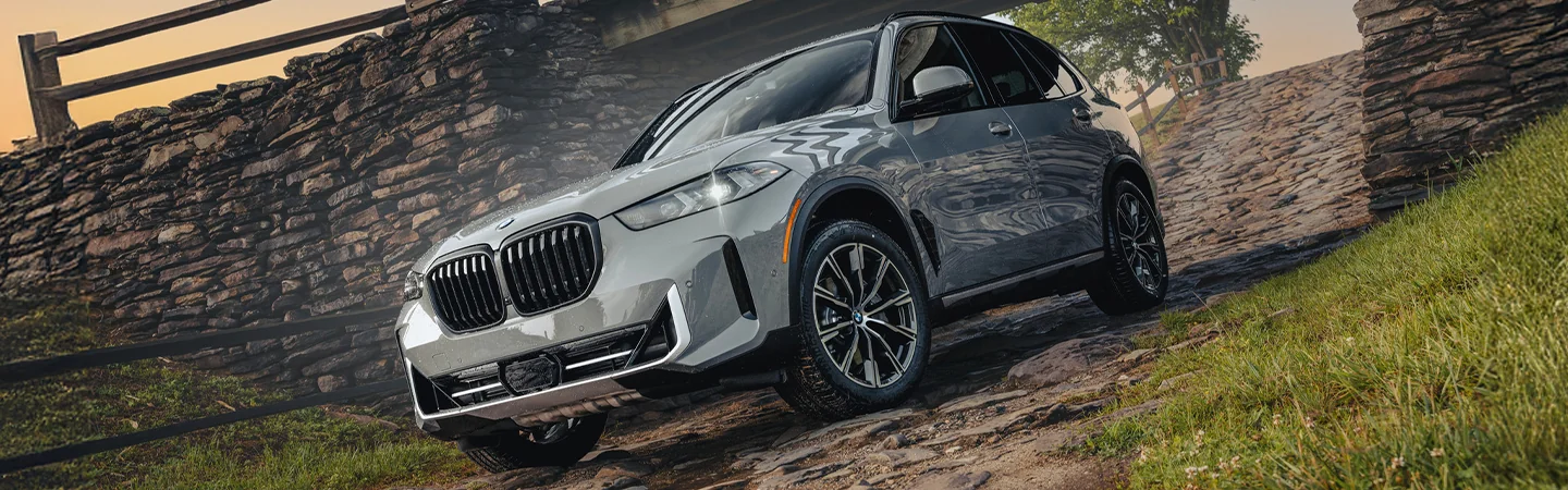 front view of a 2025 BMW X5 sDrive40i coming out a gate