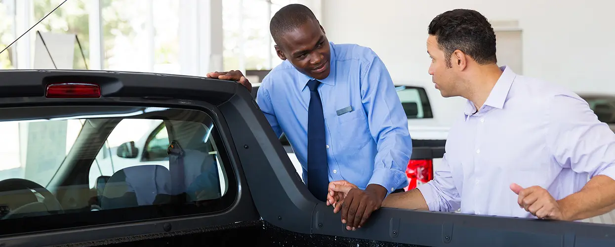 people car shopping in showroom