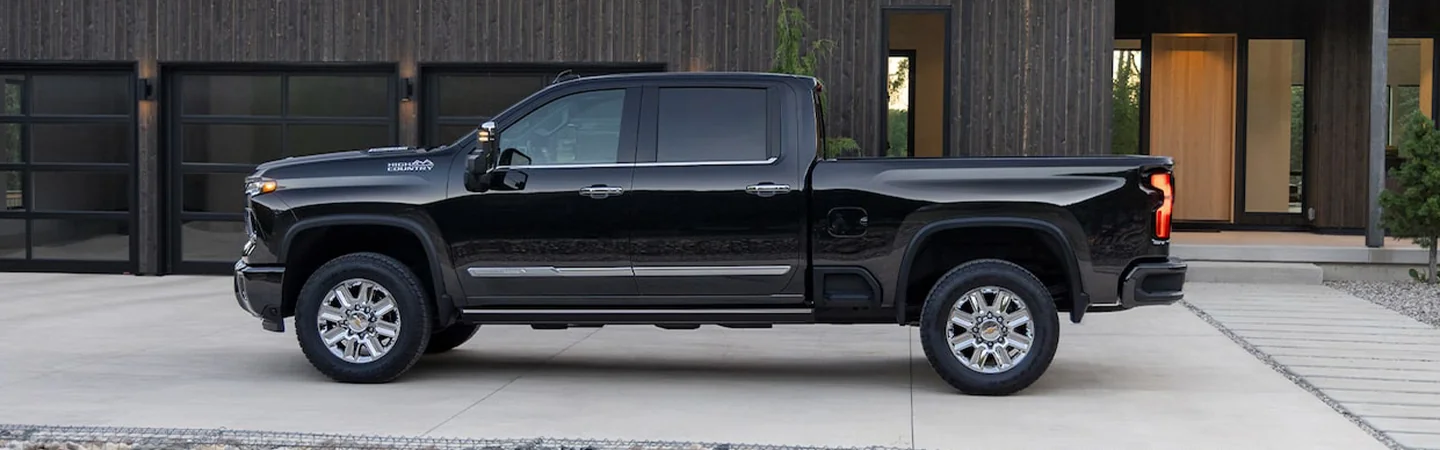 Side view of a 2025 Chevrolet Silverado HD parked in a driveway