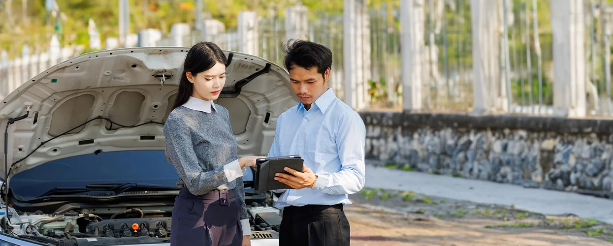 two people looking at the specifics of service there car